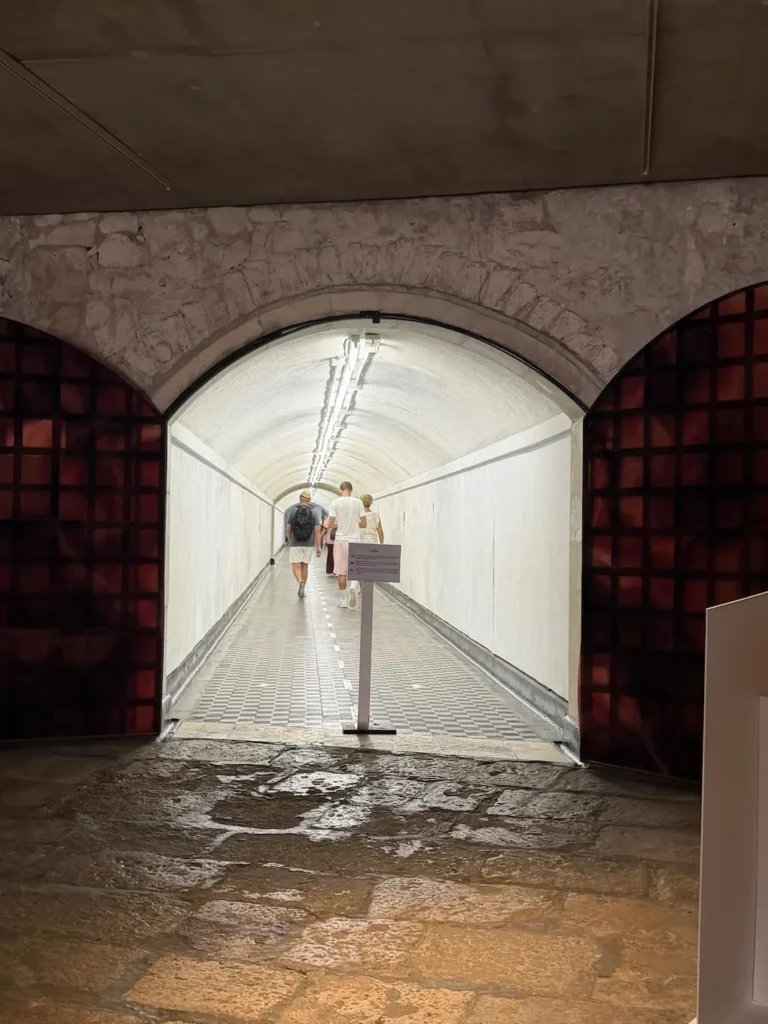 Illuminated tunnel leading to the Santa Bárbara Castle lift in Alicante